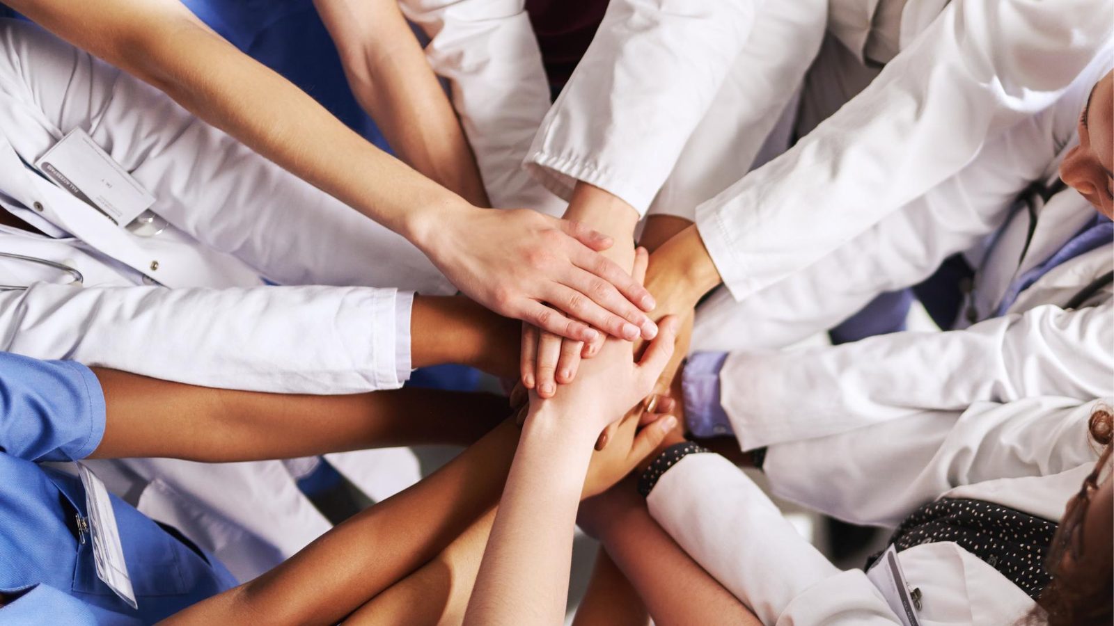 Care team hands together